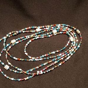 Multi colored seed beads with silver accent beads.